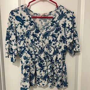 Francesca’s blue and white tie shirt